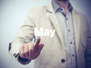 Businessman pressing button on virtual screen May button - concept