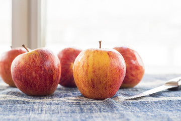 Ripe unpeeled juicy red yellow apples fall 