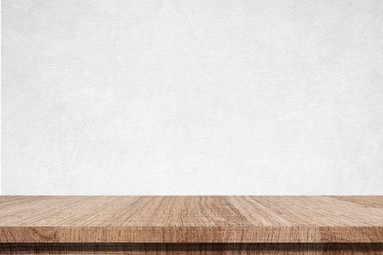 Empty wooden table over white cement wall, vintage, background, template, product display montage