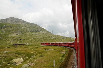 Fototapeta na wymiar Swiss mountain famous Red Train Bernina Express crossed Alps