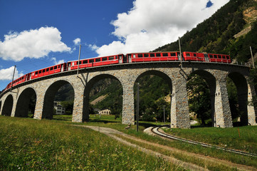 Fototapeta na wymiar Bernina Express Train at Brusio on the Swiss alps