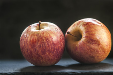 Ripe unpeeled juicy red yellow apples fall 