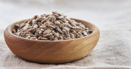 bowl of sunflower seeds isolated on white background