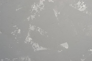 Gray heterogeneous concrete background with traces of spatula