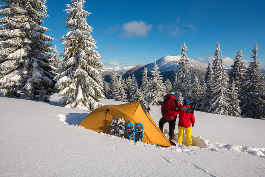 Romantic couple during the winter travel in wilderness