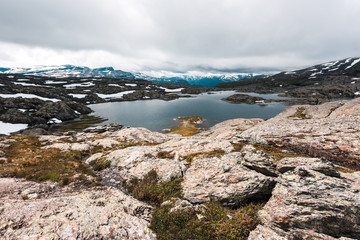 Typical norwegian landscape with snowy mountains