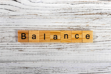 Balance word made with wooden blocks concept