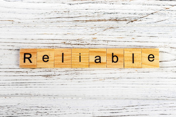 RELIABLE word made with wooden blocks concept