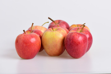 Apples in bright and juicy red colors on grey background