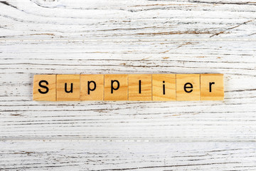 SUPPLIER word made with wooden blocks concept