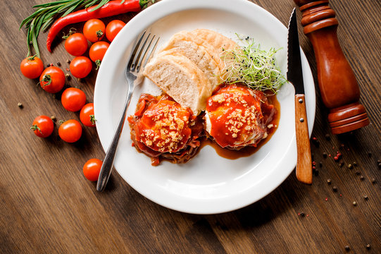 A healthy breakfast with fried egg, toast and microgrin on a wooden table.