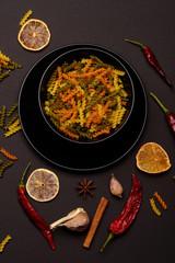 different ingredients for cooking and delicious italian pasta in plate