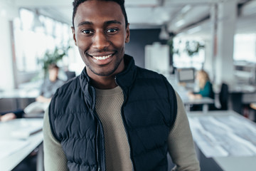 Close up of smiling businessman in office