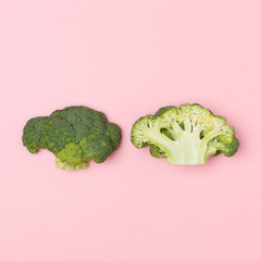 Top view of broccoli on a pastel pink background. Seasonal vegetable. Minimal concept. Vegan food.  The concept of a healthy diet