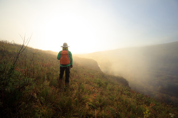 Fototapeta premium woman hiker with backpacker hiking in beautiful nature