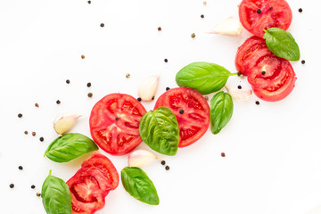 food background of tomato, garlic and basil on white background. Top view