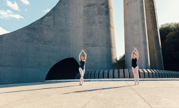 Female Ballet Dancers Practicing Duet Dance