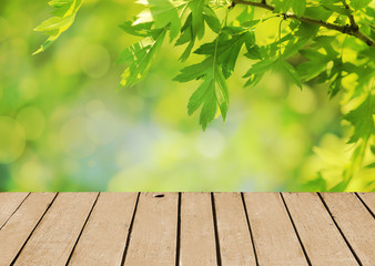 Naklejka na ściany i meble Top of wooden table on nature background