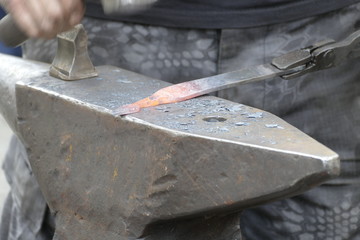 blacksmith wotk with hammer and hot iron