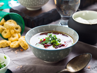 Beetroot soup served in bowls on napkin. Lunch with light vegetarian dish