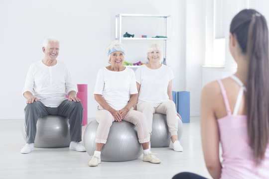 Elderly people sitting on balls