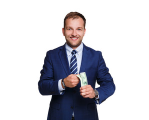 Smiling young businessman holding money isolated on white background