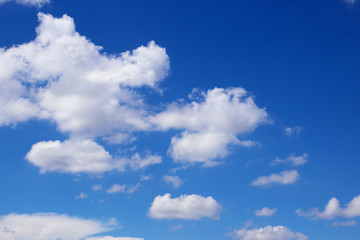 Fototapeta na wymiar blue sky background with tiny clouds