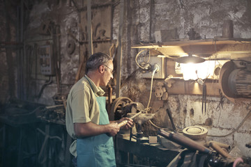 Artisan using a rasp