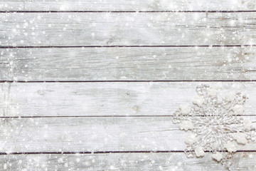 Snowflakes on a wooden background.