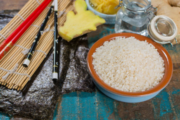 Asian food background. Sushi and rolls preparation. Making sushi at home traditional sushi ingredients.