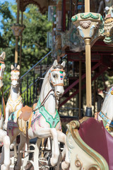 White horses of the antique carousel