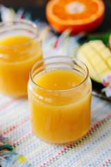 Mango and orange detox juice made from fresh fruits.