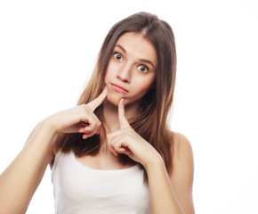 Fototapeta premium lifestyle and people concept: Beautiful young surprised woman 