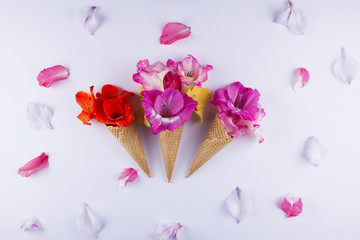 Waffle cone with composition of flowers.