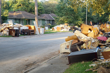  The aftermath of Hurricane Harvey: many flooded houses, owners throw away their belongings, materials that were under water. The streets are huge piles of garbage