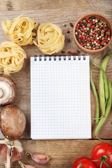 raw tagliatelle with vegetables background