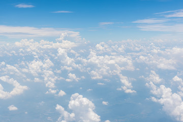 Fototapeta na wymiar Blue sky and beautiful clouds.View from window of an airplane
