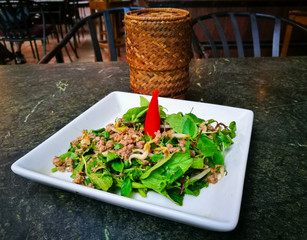 A famous Thai and Laos Food - Ground pork salad or Larb/Lap, a spicy ground pork mix with local...