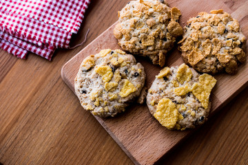 Cornflake Cookies on wooden surface.