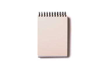 Vertical aligned isolated notebook mock up with blank white sheets on white background. Top view, flat lay.
