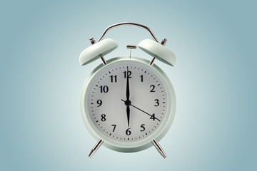 pastel retro alarm clock or vintage alarm clock isolated with clipping path