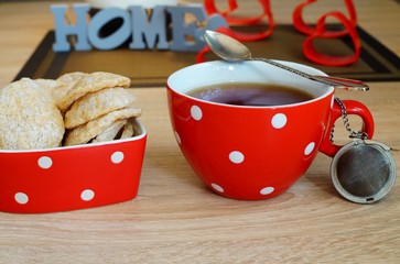 Hot tea in red cup and diet cereal wafers - selective focus
