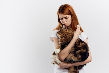 a woman holds a cat's hand, an empty space for copying