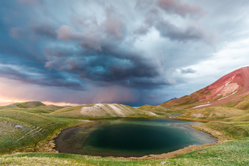 View of Tulpar Kul lake in Kyrgyzstan during the storm