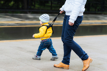  Mom insures her child during a walk