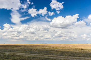 on the road with clouds