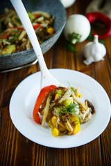 eggplant with vegetables fried in a wok