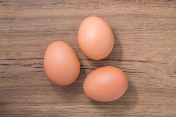 Close up group three of Egg on wooden background, isolated, fresh egg