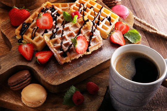 Belgian waffles with strawberries and raspberries, homemade healthy breakfast with coffee