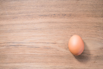 Close up Single Egg on wooden background, isolated, fresh egg